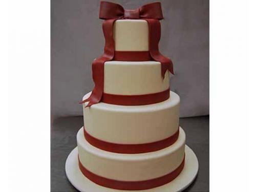 Pastel con moño rojo